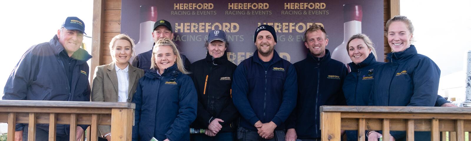 The smiling team of Hereford Racecourse pose for a picture