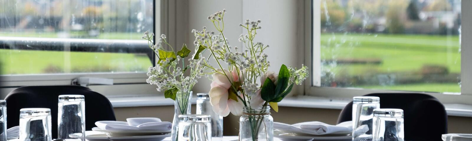 A hospitality table and the view from the private box at Hereford Racecourse.