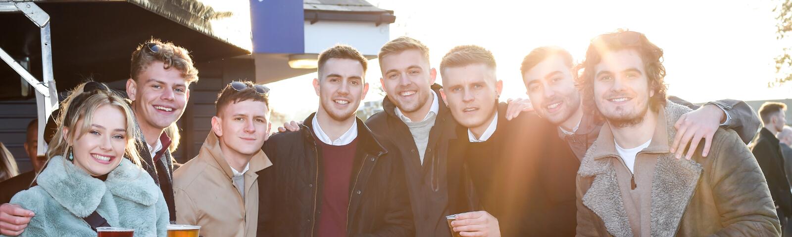 A large group of friends enjoy the races at Hereford