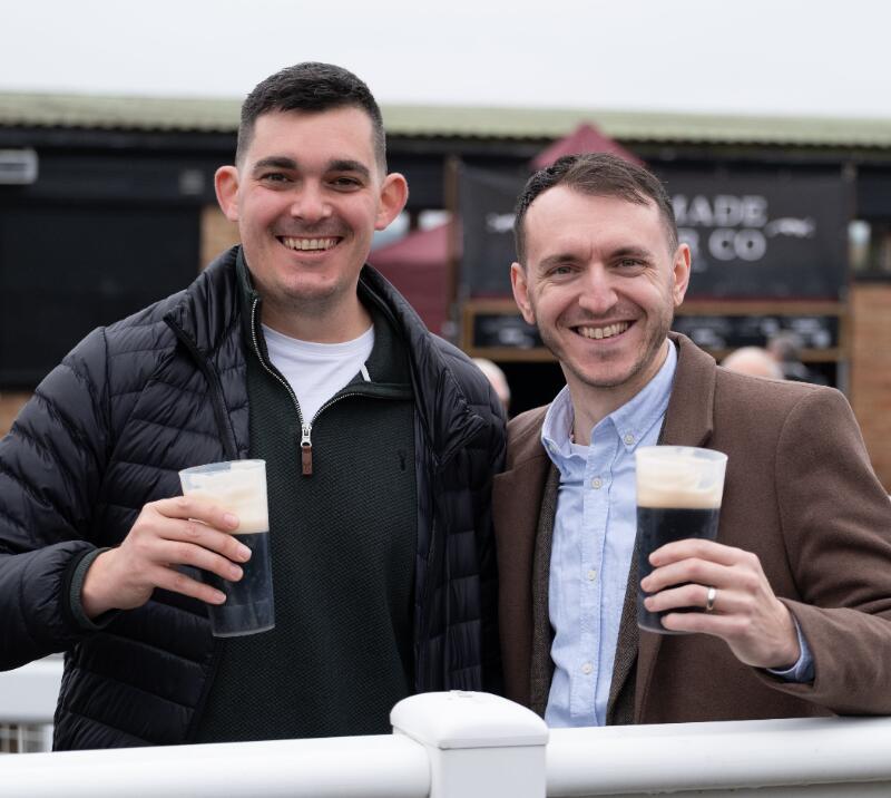 Two gents at Hereford Racecourse enjoying a beer