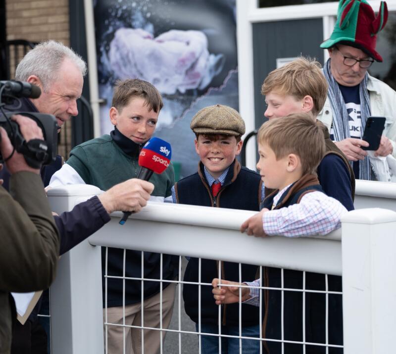 A group of children are interviewed by Sky Sports at Hereford Racecourse