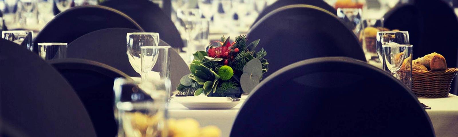 Table in a restaurant set up for a party.